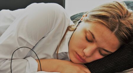 Girl sleeping in headphones