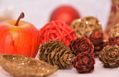 Christmas decorations, apples, cones, wicker balls on a white backgroundの写真素材