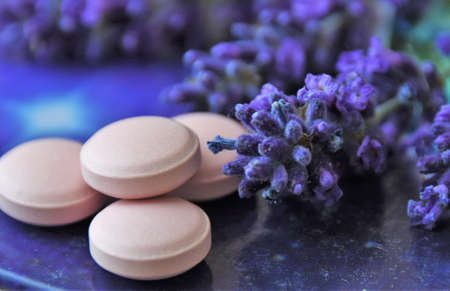 sprigs of lavender and pills