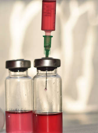 syringes and vaccine in glass ampoulesの写真素材