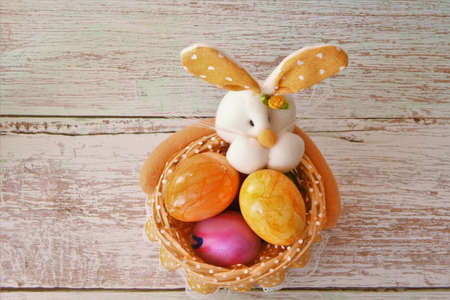 bunny with Easter eggs in a basketの写真素材