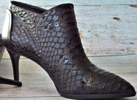 women's leather boots on a wooden floor