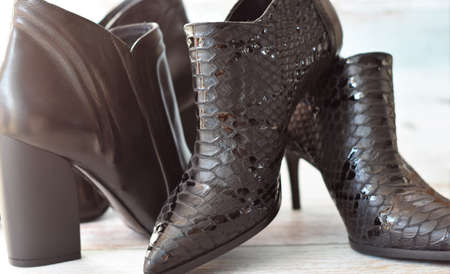 women's leather boots on a wooden floor