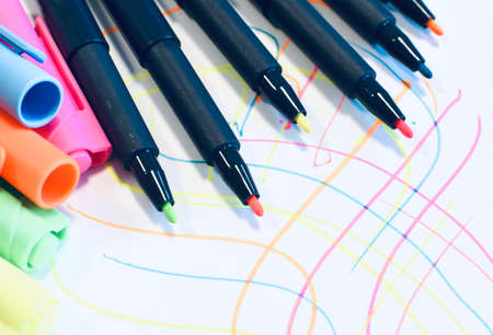 Neon markers on white paper