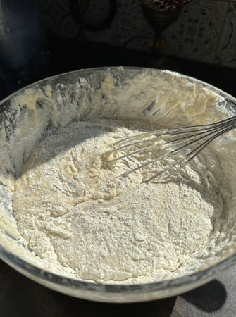 wheat flour dough is beaten with a whiskの写真素材
