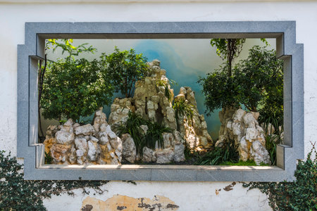 Reflection in a window of a house with terracotta stonesの写真素材