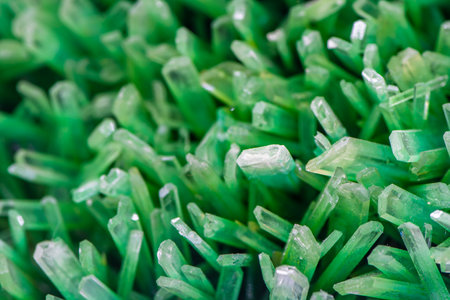 Close-up of green glass beads on a white background. Macroの写真素材