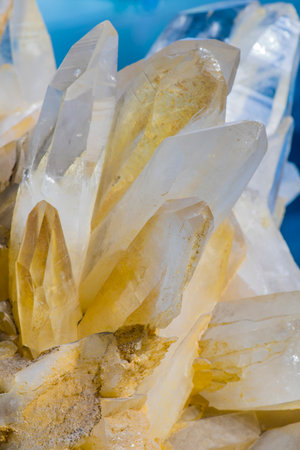 close up of natural quartz semigem crystals on a blue backgroundの写真素材