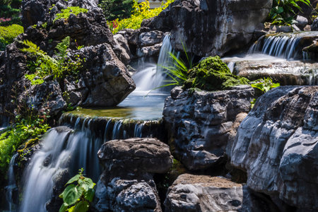 Waterfall in the garden at Chiang Rai province, Thailand.の写真素材