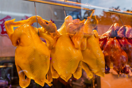 Roast chicken in the window of a shop in Barcelona, Spainの写真素材