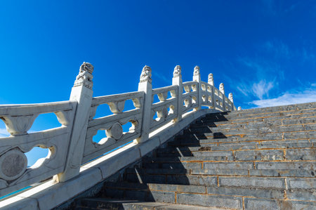 Stone stairway on blue sky background at chinese temple, Chinaの写真素材
