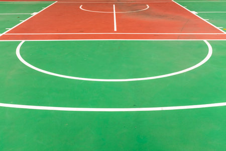 Outdoor basketball court with green and red floor, closeup of photoの写真素材