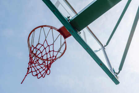 Basketball hoop and net with blue sky background, sport concept.の写真素材