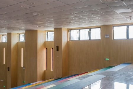 Interior of a fitness hall with wooden doors and sports equipment.の写真素材