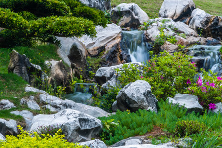 Waterfall in the garden. Beautiful landscape with waterfall in the garden.の写真素材