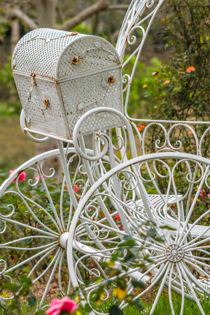 White chair with basket in the garden, closeup of photo.の写真素材