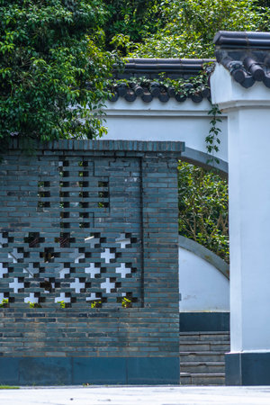Stone wall and brick fence at chinese garden, Chiang Mai, Thailand.の写真素材