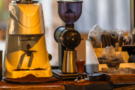 Close up of coffee grinder and coffee beans in coffee shop.の写真素材