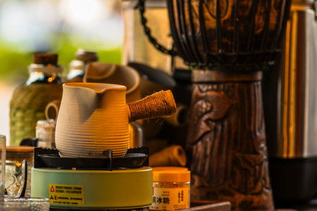 Coffee grinder and coffee cup on table in coffee shopの写真素材