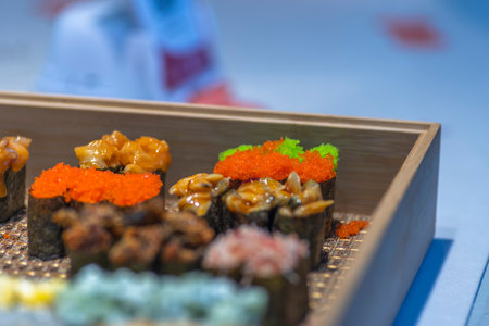 Sushi in a wooden box, close-up, selective focusの写真素材