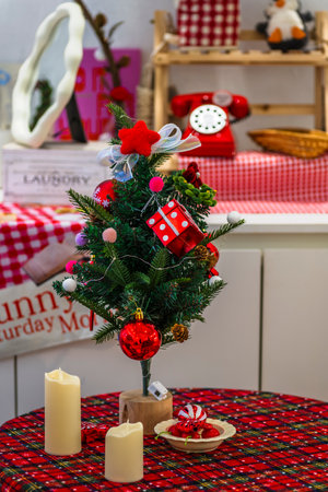 Christmas tree with gifts and candles on a wooden table. Christmas backgroundの写真素材