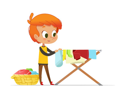 Adorable little redhead boy hanging washed clothes on drying rack isolated on white background. Home activity for kids in Montessori environment. Colorful vector illustration in flat cartoon style.のイラスト素材