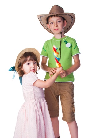 little boy and girl holding lollipopの写真素材