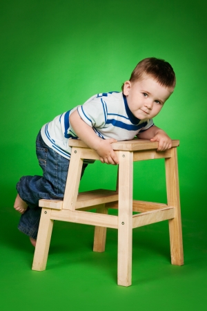 little boy on stairs in studio の写真素材