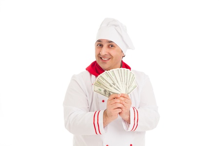 cook man holding fan of dollars wearing white uniform in the studio over white background. isolated の写真素材