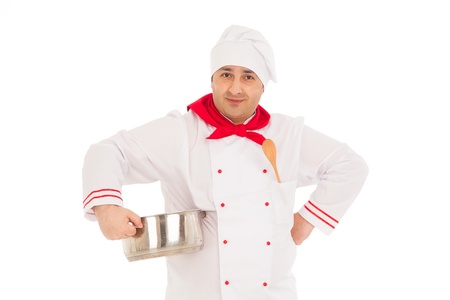 smiling chef holding saucepan weraing red and white uniform over white background の写真素材