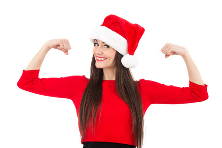  woman in a red Santa hat with matching lipstick  in a surprised expression, isolated on white with copy space for your textの写真素材