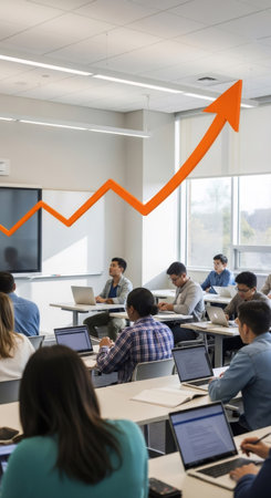 Group of students in a modern classroom attend a lecture featuring an overhead orange rising graph. Education and business growth concept.の素材