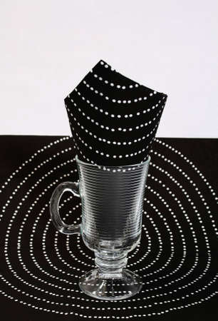 Black napkin in a glass, a glass on a black napkinの写真素材