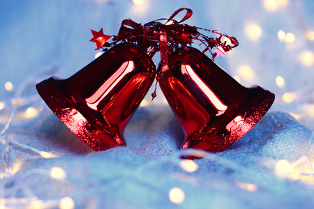 Red Christmas bells and garland lightsの写真素材