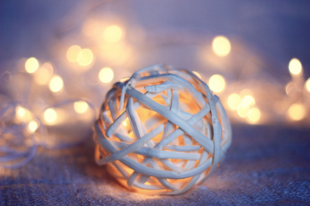 wood wicker Christmas glowing ball and garlandの写真素材
