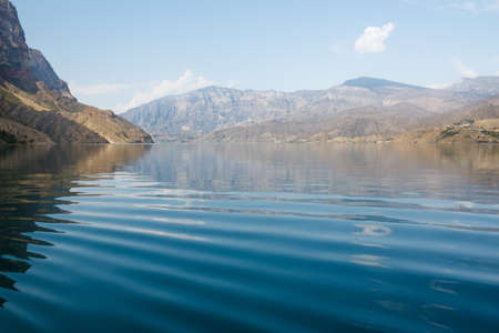 Beautiful lake in the mountains, Irganai reservoir in Dagestan, Russia. Waves on the water surface.の写真素材