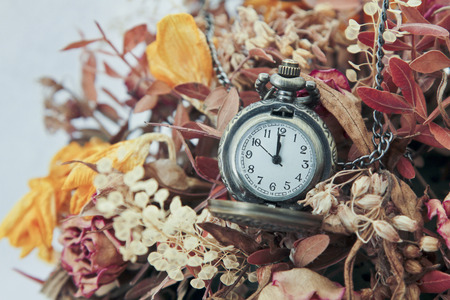 watch on a chain in a flower basketの写真素材