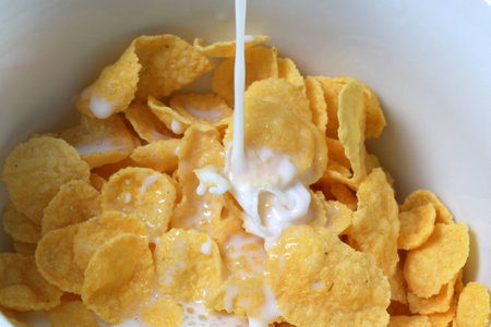 corn flakes with milk in a bowl