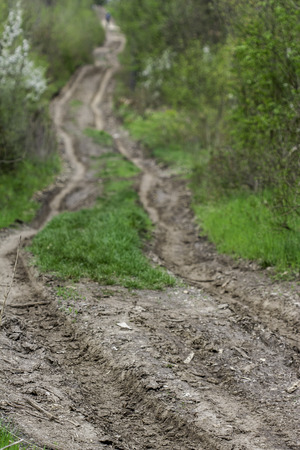 view of a tortuous rural dirt roadの写真素材