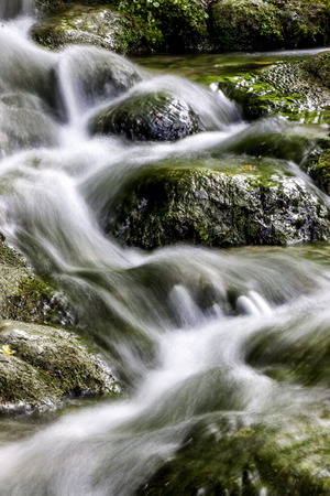flowing water between rocks at Plitvice National Parkの写真素材