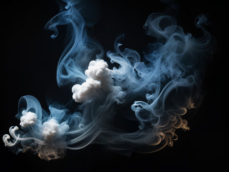 Smoke swirls flowing on a simple black background.の素材