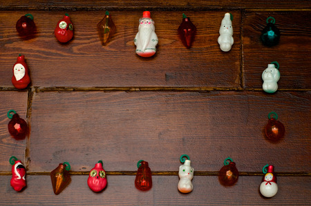 Frame out of small tree toys on the wooden tableの写真素材