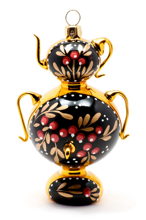 Isolated macro shot of Russian Khokhloma samovar or kettle over whiteの写真素材