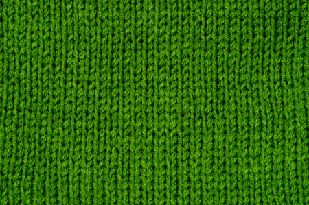 Simple knitted green background, classic pattern macroの写真素材