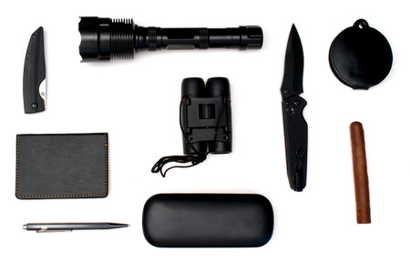 Isolated knives, cigar, notebook,lighter torch and pen over whiteの写真素材