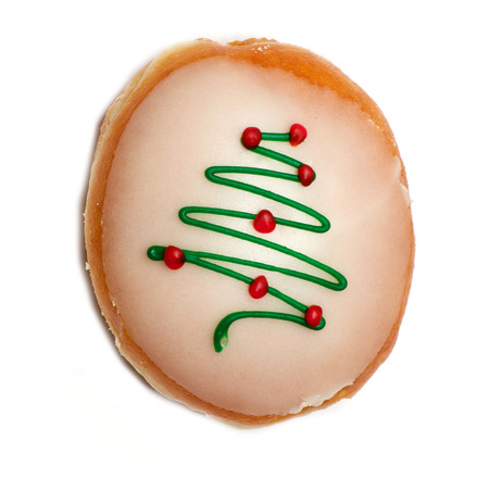 Isolated glazed donut with christmas tree over whiteの写真素材