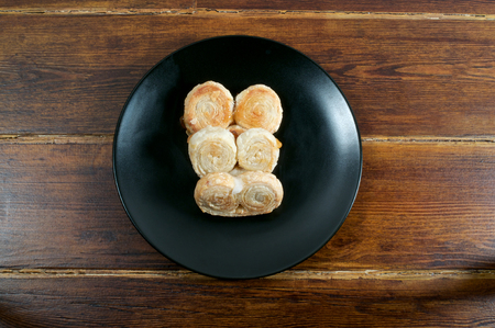 Puff pastry from top on the place plate over wooden tableの写真素材