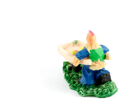 Colorful small hand-made clay figurine of rooster, chickenの写真素材