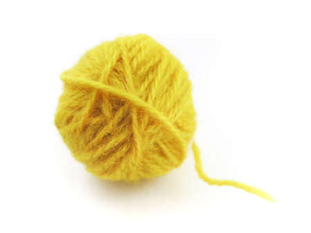 Yellow ball on a white background for knittingの写真素材