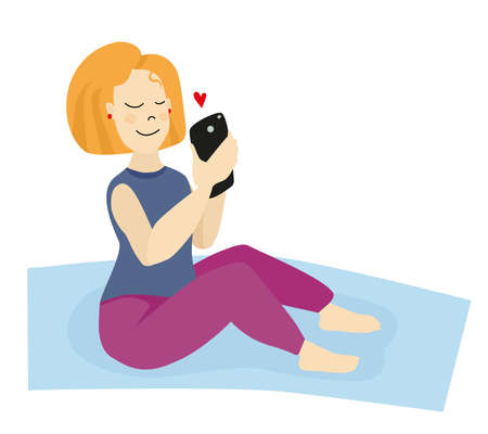 A girl with blonde hair on a yoga mat looks at her phone and receives a love messageのイラスト素材